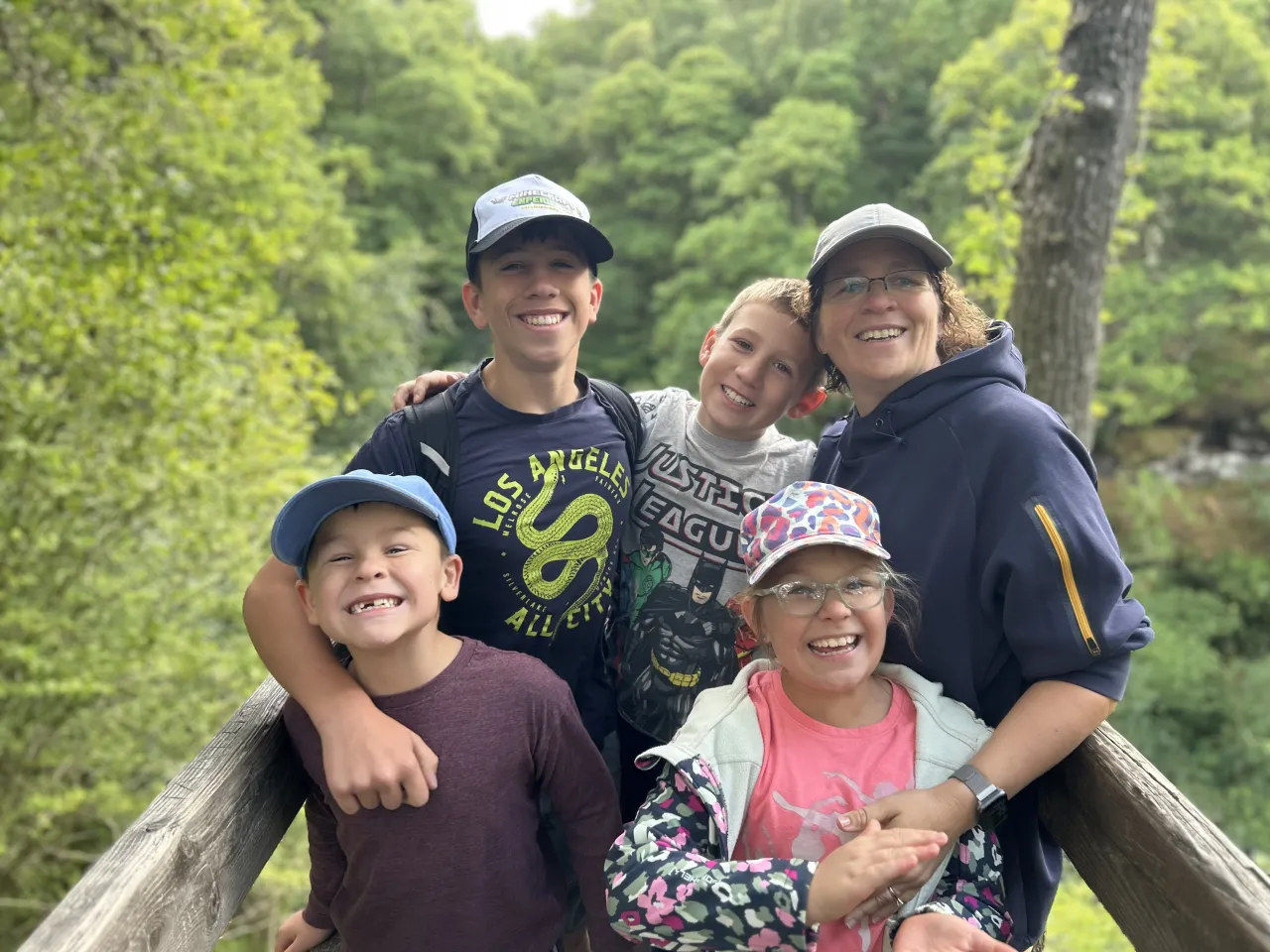 Mags Jacobs on a woodland walk with her four children, everyone smiling